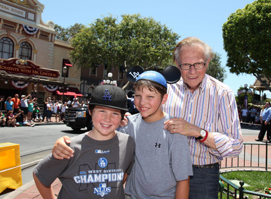 Larry King at the parade with his sons  Cannon, 10, (left) and Chance, 11
