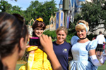 North Dakota 2010 Beth Dennison (center), of Hutchinson, N.D. poses for a photo with Belle (left) and Cinderella (right) at the Magic Kingdom.