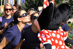 Miss Alabama 2010 Ashley Davis (left), of Dothan, Ala., gives Minnie Mouse a kiss at the Magic Kingdom.