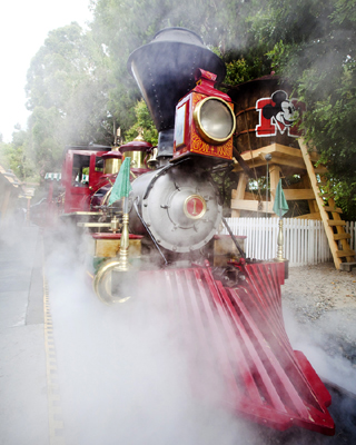 Train Stopped Next to the Mickey Mouse Water Tower in Toontown, By: Paul Hiffmeyer Train Stopped Next to the Mickey Mouse Water Tower in Toontown, By: Paul Hiffmeyer