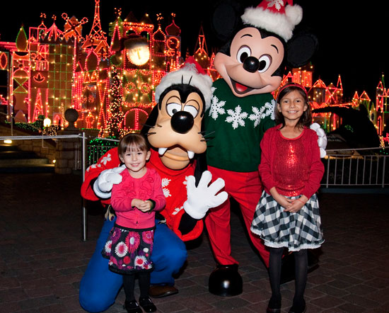 Adela Jauregui, 8, a Patient at CHOC Children's, and her sister with Mickey Mouse and Goofy