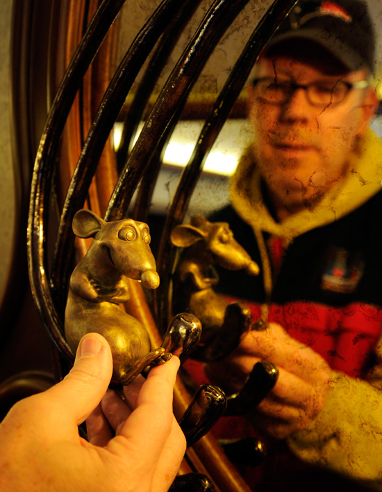 An Imagineer Inspects the Remy Sculpture on the Disney Dream
