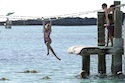 Children play in the clear waters of Castaway Cay