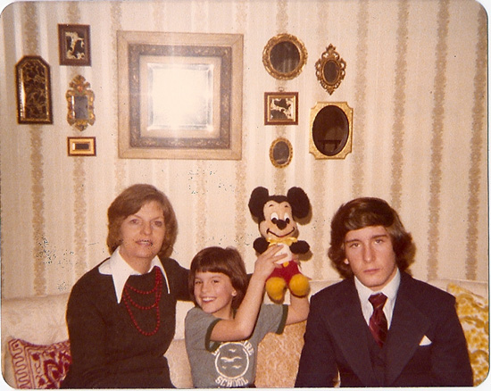 Kelly Glassburn Proudly Holding Up Her First Mickey Mouse Plush
