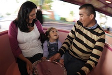 Chilean miner rescuer Patricio Alejandro Sepulveda Munoz (right) takes a spin with his daughter Esperanza Anais Sepulveda (center, age 2) and his wife Yessica Vivian Sepulveda (left) on The Mad Tea Party attraction at the Walt Disney World Resort