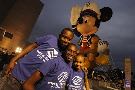 Boys & Girls Clubs Children Lorenzo White (13), Germaine Childs (9) and Tyasia Childs (6) Posed with the Giant Sailor Mickey Mouse Balloon