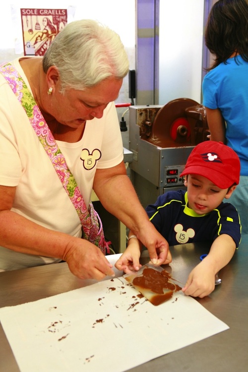Guests mold a delicious chocolate treat during a Port Adventure in Barcelona
