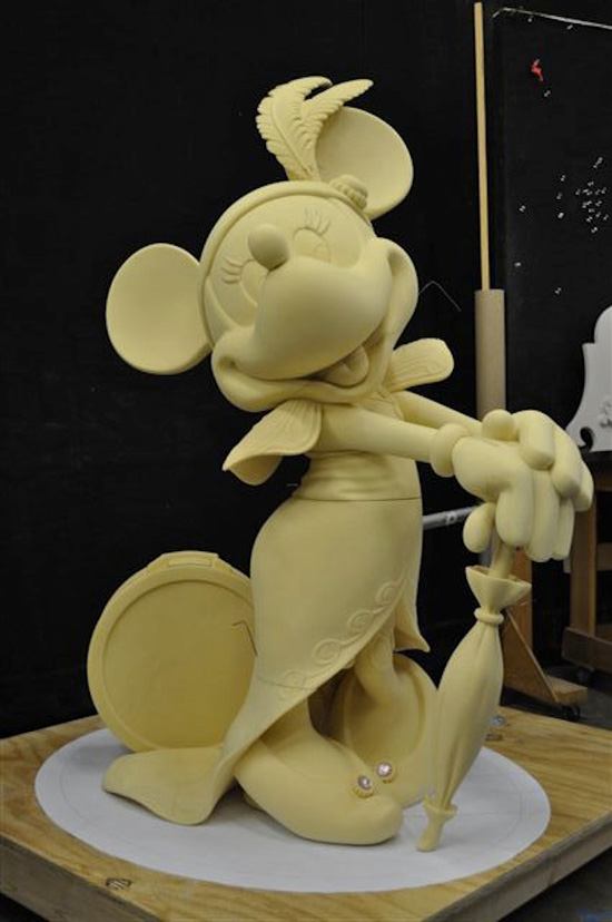 Mademoiselle Minnie Mouse serves to welcome guests as they enter the atrium lobby of the Disney Fantasy.
