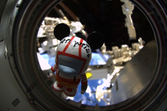 The customized Mission:SPACE-inspired Vinylmation floats inside Space Shuttle Atlantis