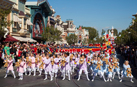 Little girls dance for joy at receiving a Duffy the Disney Bear.