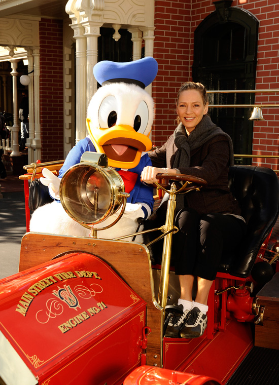 Award-Winning Actress Uma Thurman Poses with Donald Duck in the Famed 'Engine #71' Fire Engine on Main Street, U.S.A., at Magic Kingdom Park Award-Winning Actress Uma Thurman Poses with Donald Duck in the Famed 'Engine #71' Fire Engine on Main Street, U.S.A., at Magic Kingdom Park