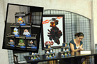 Disney Parks Vinylmation Artist Maria Clapsis Signs One of Her ‘Star Wars’ Creations (As Seen in the Inset) in Darth's Mall