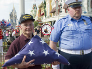 World War II Veteran and Purple Heart Recipient Louis Lessure Participates in the Flag Retreat Ceremony at Magic Kingdom Park