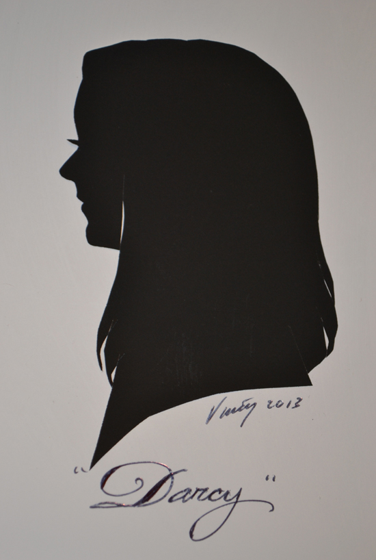 Artist Vincent's Portrait of Author Darcy Clark at Silhouette Portraits at the Downtown Disney Marketplace at Walt Disney World Resort Artist Vincent's Portrait of Author Darcy Clark at Silhouette Portraits at the Downtown Disney Marketplace at Walt Disney World Resort