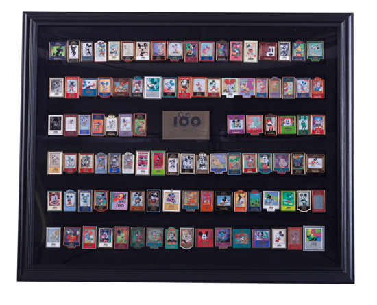 Developed in 2002 in Celebration of the 100th Birthday of Walt Disney, this Framed Commemorative Pin Set Includes One-Hundred Limited-Edition Pins Inspired by the Artwork of Artist Eric Robison Developed in 2002 in Celebration of the 100th Birthday of Walt Disney, this Framed Commemorative Pin Set Includes One-Hundred Limited-Edition Pins Inspired by the Artwork of Artist Eric Robison